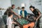 Woman and man in army uniform and cheerful kids playing table