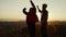 Woman and man dancing on top of mountain. Couple making funny moves during dance