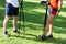 A woman and a man doing nordic walking in the park