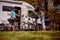 Woman with a man on electric bike resting at the campsite.