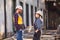 Woman and man, factory employees chatting during lunch break