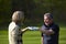 Woman and man golfers congratulating