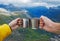 Woman and man hand holding together camping mugs with hot tea