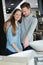 Woman and man in plumbing furniture store looking sink