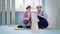 woman and man in protective helmet discuss floorboards while sitting on polystyrene foam for floor in room during