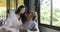 Woman And Man Sit In Armchair Kiss Using Tablet Computer Talking Touch Screen Browsing Online Internet, Young Couple At