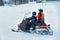 Woman and Man on Snowmobile at Winter Finland