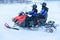 Woman and Man in Snowmobile in Winter Finland Lapland Christmas