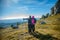 Woman and man tourists hiking in Karst, Slovenia