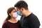 Woman and man wearing medical mask touching nose eskimo kiss