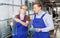 Woman and man working in glass workshop