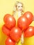 Woman in many balloons