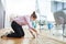 Woman marks floor with tape for keeping distance in the office