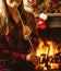 Woman with marshmallow by the fireplace. Young woman smiling and