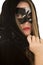 Woman mask cloak lipstick close serious