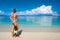 woman with mask going to snorkel in tropical sea