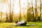 Woman with mask meditating/practicing yoga in nature alone.Social distancing and active healthy lifestyle. Mindfulness meditation.