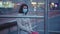 Woman in mask sitting at bus stop