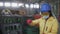 Woman in mask working at the recycle waste separation of recyclable waste plants. Sorting and arranging glass bottles