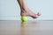 Woman massage with tennis ball to her foot in bedroom,Feet soles or heel massage for plantar fasciitis