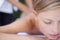 Woman, massage and therapist for wellness, back and spa for treatment and stress relief skincare. Sleeping, masseuse and