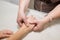 Woman masseuse doing hand massage to client