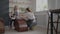 Woman master transfers knowledge to an elderly woman working on a potter's wheel and making a mug of ceramics in her