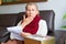 Woman Mature Taking Medicine. Woman Holding Blister Pack With Pills In Hand And Reading Medical Instructions.