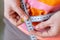 Woman measures her abdomen with a measuring tape