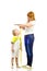 Woman measuring child