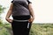 Woman measuring her hips with measure tape