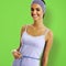Woman in measuring waist. Green background. Sporty african american girl. Health, dieting, fitness gym center