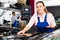 Woman mechanic demonstrating repainted car