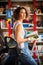 Woman mechanic with a wrench and repair manual in his hand