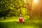 Woman mediating in yoga asana in the garden.