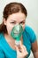 Woman in medical inhalation mask