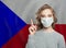 Woman in medical mask pointing up against national flag Czech Republic background. Flu epidemic and virus protection concept
