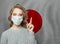 Woman in medical mask pointing up against national japanese  Flag background. Flu epidemic and virus protection concept