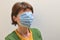 Woman With Medical, Surgical Mask Cover On Her Face