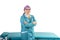 A woman in a medical uniform in a beauty parlor waiting for a client.