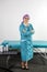 A woman in a medical uniform in a beauty parlor waiting for a client for procedures.