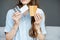 Woman with medicines on the grey background