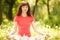 Woman meditate in the park