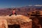 Woman meditating doing yoga in Canyonlands National park in Utah