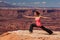 Woman meditating doing yoga in Canyonlands National park in Utah