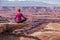 Woman meditating doing yoga in Canyonlands National park in Utah