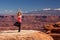 Woman meditating doing yoga in Canyonlands National park in Utah