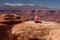 Woman meditating doing yoga in Canyonlands National park in Utah, USA