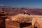 Woman meditating doing yoga in Canyonlands National park in Utah, USA