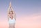 Woman Meditating peacefully yoga in twilight sky